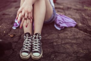 young girl wearing sneakers