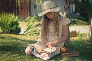 Young Girl sitting and Reading