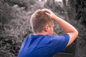 teenage boy looking away from the camera