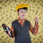 a child in a typical painter outfit with emoji background